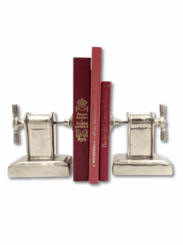 zestaw dwóch podpórek do książek metalowych w formie prasy ciekawy gadżet na półkę z książkami lub do gabinetu