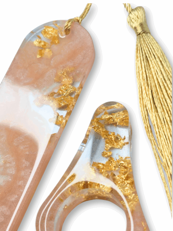 uchwyt na kciuk z żywicy i zakładka z płatkami złota