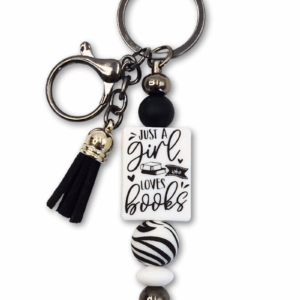 zabawny breloczek motyw zebry czarno-biały dla miłośniczek czytania