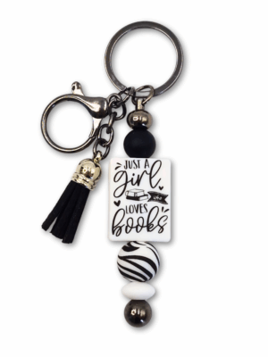 zabawny breloczek motyw zebry czarno-biały dla miłośniczek czytania