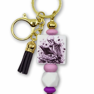 breloczek czytelniczy ze szkieletem czytającym książkę prezent dla miłośników książek