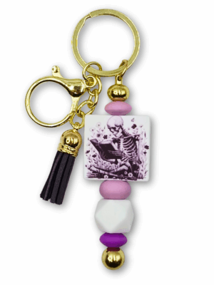 breloczek czytelniczy ze szkieletem czytającym książkę prezent dla miłośników książek