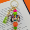 Breloczek_szalonej_książkary_03 breloczek bag charm prezent dla szalonej książkary z przymrużeniem oka dla miłośniczki książek bibliotek księgarni i czytania dla bibliotekarki, dla mola książkowego