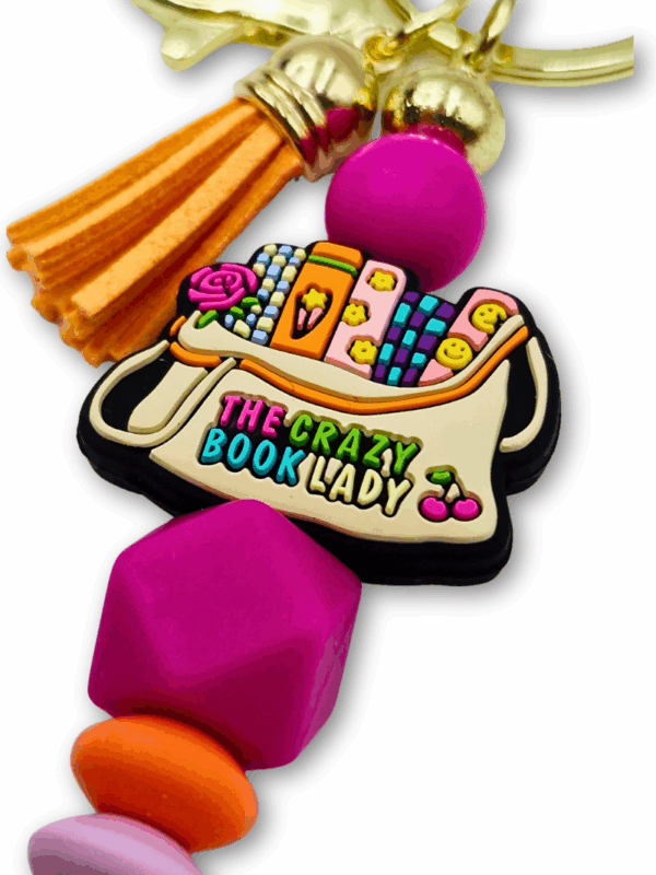 breloczek różowo-pomarańczowy prezent dla bibliotekarki i miłośniczki książek the crazy book lady