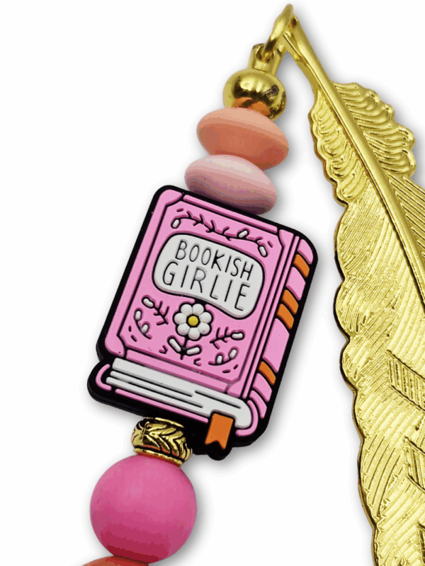 zakładka metalowa dla młodej miłośniczki czytania różowa z piórem w złotym kolorze