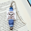 zakładka do książki metalowa z niebieskimi akcentami dla miłośników literatury fantasy na prezent