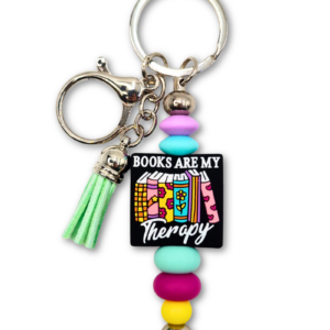 Kolorowy breloczek książkowy bag charm zawieszka do torebki lub plecaka idealna na prezent dla miłośniczki książek i czytania z napisem Books are my therapy