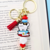 breloczek book charm książkowy motyw kota i książek zawieszka do torebki lub plecaka na prezent dla książkary