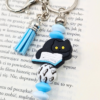 breloczek zawieszka do torebki kot i książki w kolorze błękitnym