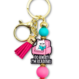 zabawny breloczek z kotem i napisem go away i'm reading dla książkar i miłośniczek kotów na prezent