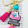 go away i'm reading - breloczek bag charm z kotem i zabawnym tekstem z chwostem dodatek do twojej torebki lub na prezent dla przyjaciółki