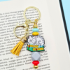 breloczek bag charm z kotem w okularach